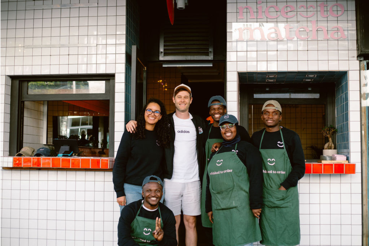 The Nice To Matcha team standing outside the Sea Point matcha bar in Cape Town